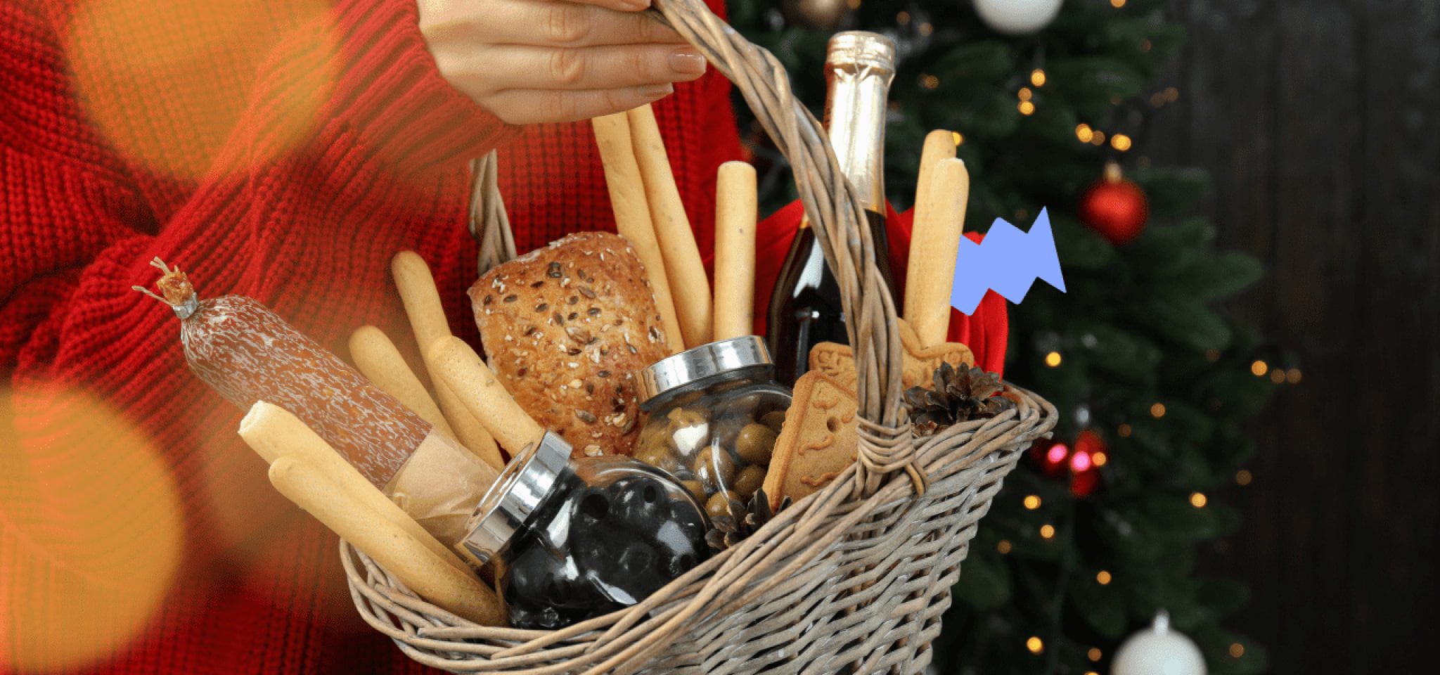 A person holding a Christmas basket