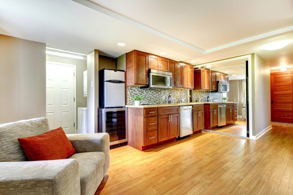 Wide angle shot of a renovated basement apartment