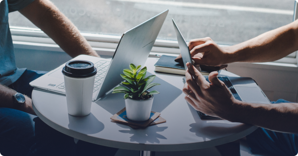 Two people using different digital methods to screen tenants.